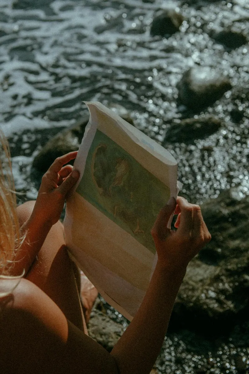 Reading in the water with the laptop closed and out of frame.